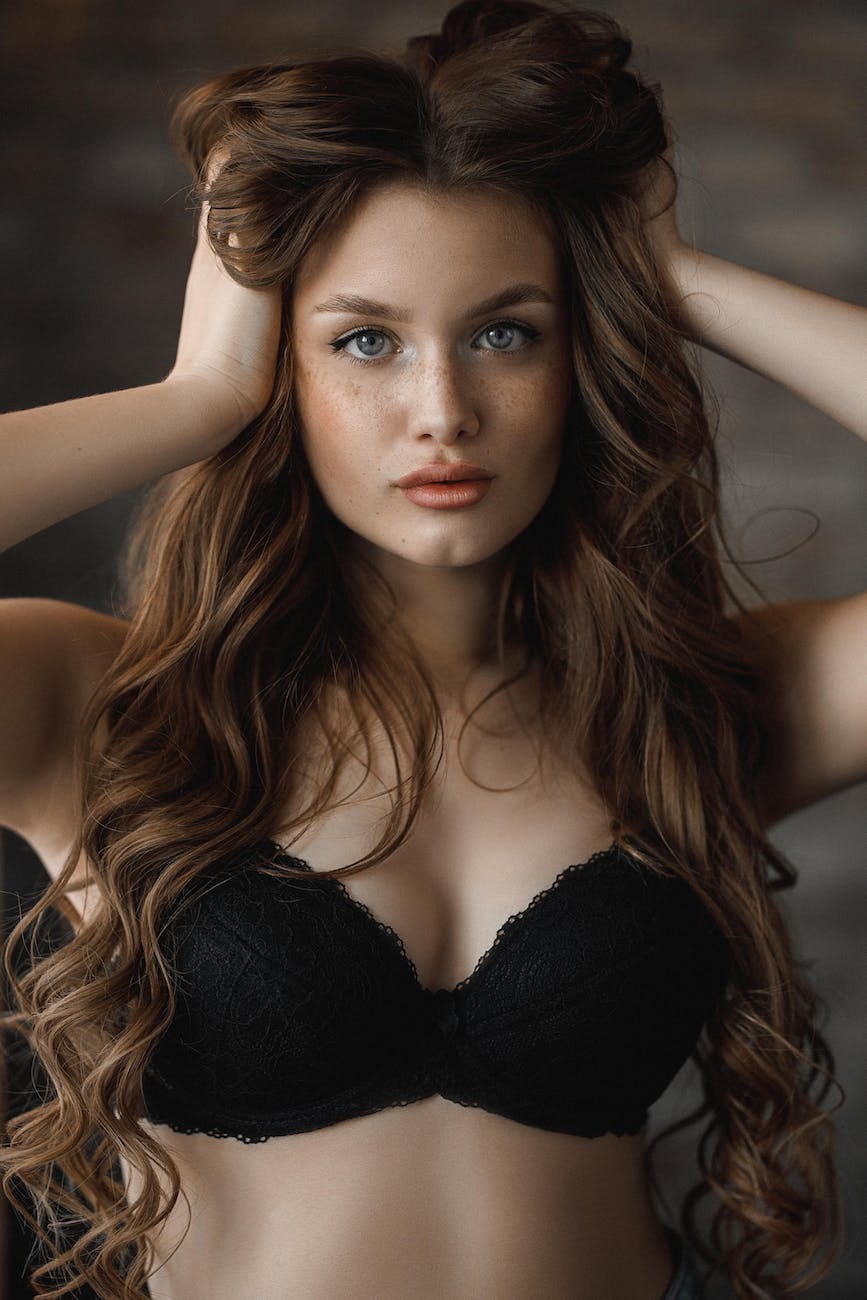 attractive female undressed model presenting black bra